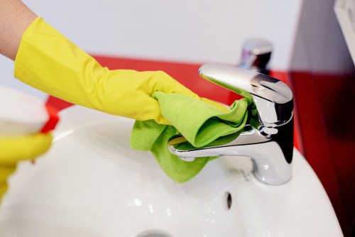 Professional oven cleaner in Tufnellpark cleaning a greasy oven interior