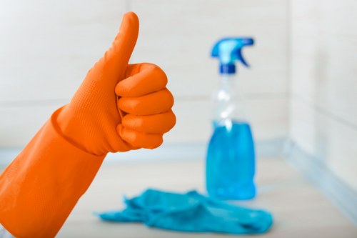 Cleaning staff handling products carefully with proper precautions