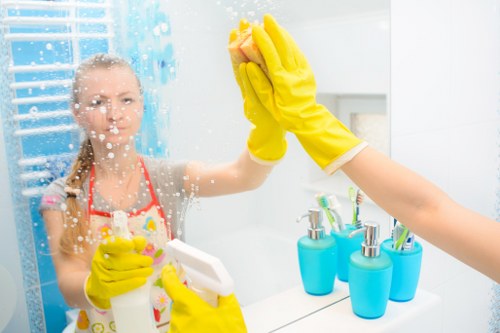 Office cleaners maintaining a tidy meeting room in Tufnellpark